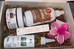 Her Crown and Glory's Spring 2024 Loc Box including products from Made For Locs and Oyin Handmade, also including a plumeria hair clip 