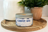 Carpet Bag Soy Wax Candle by THeme Park Candles.  This smells like our favorite nanny's handbag.  Tapestry, chimney smoke, and cherry wood.
