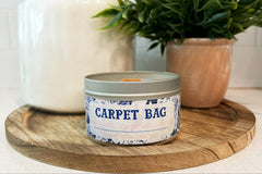 Carpet Bag Soy Wax Candle by THeme Park Candles.  This smells like our favorite nanny's handbag.  Tapestry, chimney smoke, and cherry wood.