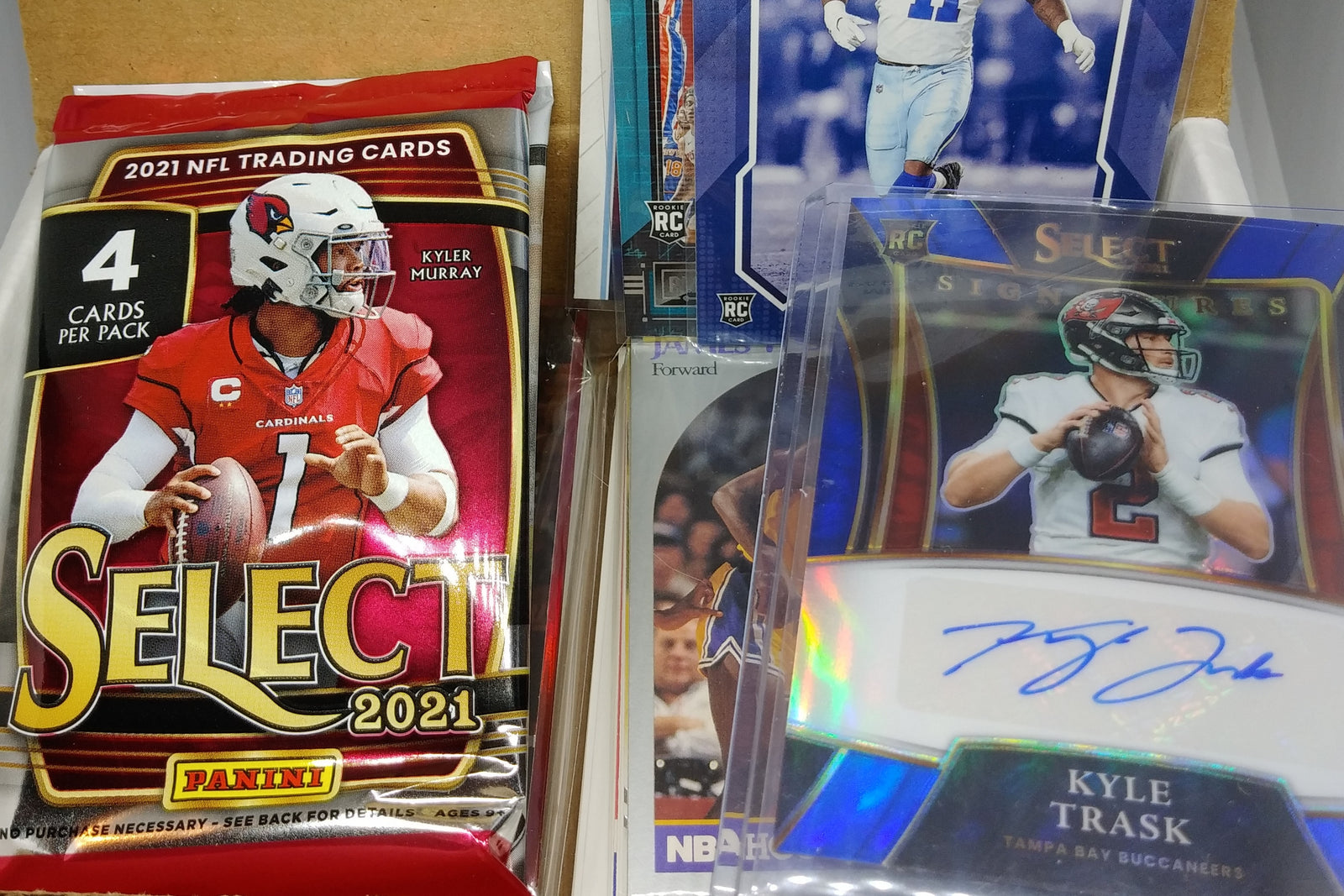 A sample of our Football Sports Subscription Box featuring an autograph card in addition to our card packs and repack.
