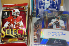 A sample of our Football Sports Subscription Box featuring an autograph card in addition to our card packs and repack.