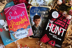 Brown subscription box filled with four young adult light reading books, featuring engaging stories and relatable characters for teen reader