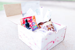A Shark Week Survival Kit period subscription box featuring essential supplies for a comfortable and confident experience. 