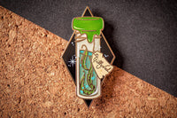 Gold plated, hard enamel pin depicting Gillyweed in a translucent enamel bottle. Printed details and scroll.
