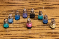 Handmade Pixie Dust bottles for necklaces. These are an assortment of colors and will come with the chain for the necklace. 