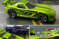 The Hot Wheels monthly subscription box containing a personalized car with name, display case, additional new cars, and accessories.