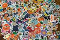 Pic shows assortment of stickers as an example of what can come in a Quirky Pickle pack. Stickers for packs are selected based on age range.