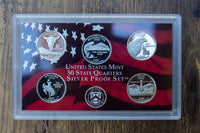 United States Mint State Quarters Silver Proof Set including 5 silver coins in a sealed collector's box.