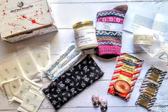 A Shark Week Survival Kit period subscription box featuring essential supplies for a comfortable and confident experience. 