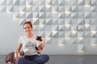 Young woman wearing a Harry Potter Deathly Hallows Purple Triangle and Flowers Tshirt and holding 2 cats.