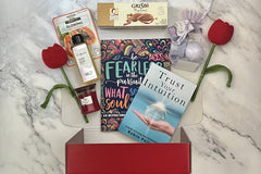 The Stress Relief Adult Coloring Book Box will include a book, an adult coloring book, colored pencils, as well as 2 - 3 self-care products.