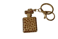 Backside view of Champaign Gold Rhinestone key chain.  Well made, with many uses:  decorative on purse, earbud case, or as a key chain,