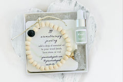 Raw Wood Diffuser Bracelet with Gray Jade Triangle Charm in White Gift Box with Aromatherapy Instruction Card and Woodlands Mini Oil Dropper