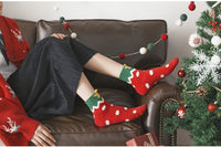 Vintage plaid socks, boasting festive hues of green and red, capture the essence of the season, with patterns reminiscent of the warmth .