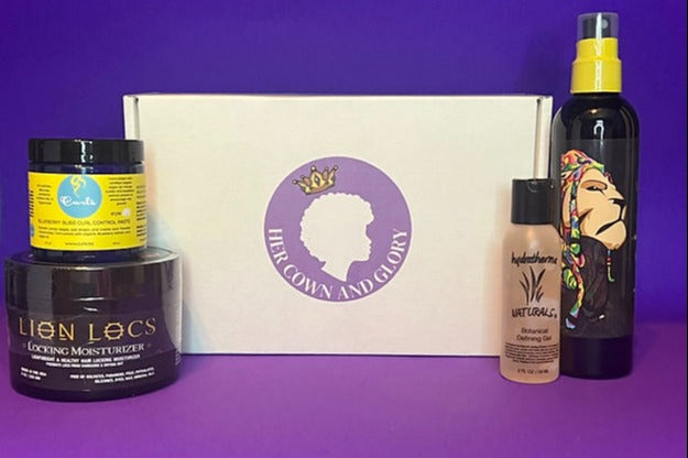 Her Crown and Glory Loc Box propped up with products for the box standing in front of a purple background 