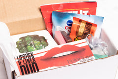 A Shark Week Survival Kit period subscription box featuring essential supplies for a comfortable and confident experience. 