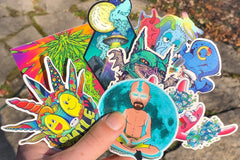 Colorful assortment of stickers from the Monthly Sticker Savages Box featuring monsters and whimsical designs for water bottle stickers