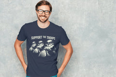A smiling man wearing a blue Tshirt with 3 Stormtroopers on it. The Shirt says "Support the Troops".