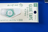 Close-up picture of notebook, pencils, stickers, pen, eraser, and business card. These items are an example of what may be included.