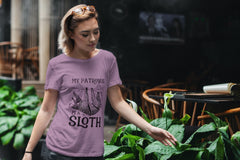 Lady looking at plants and wearing a lilac colored Harry Potter sloth tshirt that says My Patronus is a sloth.