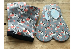 Strawberry Milk Cow Crew and No-Show Socks with a grey background.  White, Black, and Reddish/Pink with cute cows and strawberries.