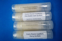 4 Natural, homemade lip balms  Raspberry, Watermelon, Pink Bubblegum and Cherry flavours. A Close up picture.