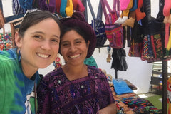 International Blessings owner Sarah Barnett with an artisan she purchased products from in Guatemala. 