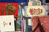 Assorted panda-themed stationery items from the Paper Overhaul subscription box, featuring notepads, stickers, and pens