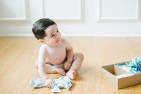 Cute baby boy with his Surprisly box