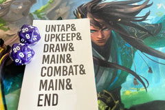 Two purple D-20 dice and a Magic: The Gathering sticker against a colorful Magic: The Gathering background.