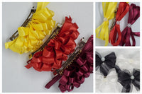 A previous fall package with ruffle hair bows and double bows in bright yellow, bold red, and beautiful burgundy echoing seasonal colors.