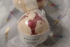 Two gift-wrapped Luxury Bath and Body Boxes by Lavish on a table.