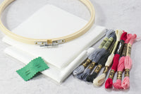 Cross stitch kit materials include instructions & tips guide, color black/white patterns, embroidery thread, fabric, needle