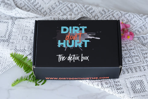 A closed The Detox Box subscription box that says dirt don't hurt.