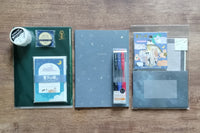 Packs by Misty Co. stationery subscription bundles with notebook, 3pk pen set, washi tape, letter sets and small 3 pocket plastic folder.
