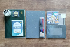Packs by Misty Co. stationery subscription bundles with notebook, 3pk pen set, washi tape, letter sets and small 3 pocket plastic folder.
