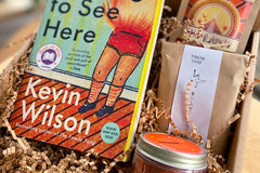 Sample box: Nothing to See Here by Kevin Wilson about twins who spontaneously catch on fire, with candles, spices, and spicy chocolate.