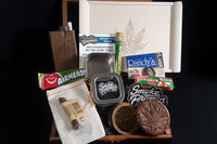 Loaded n' Rollin' by Dank Box showcases various smoking accessories in a wooden subscription box