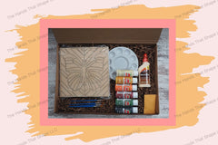 Unpack the DIY kit, thoughtfully curated with everything needed to create the captivating Butterfly on Chevron art piece.