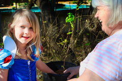 Planting raspberries with family and celebrating Mother's Day, home garden, Austin Texas, photo credit to Paul Facey