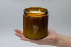 Our team does every step of the candle making process by hand, from putting wicks in the candles to designing the labels.