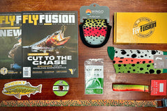 Fall 2023 Gear Box includes Cheeky Leader and Tippet, Wingo Socks, Reel case, Cam Strap and Key Fob, 2 issue of Fly Fusion and MORE!