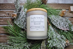Fan favorite French Vanilla featured in photo. Beautiful photo with an evergreen backdrop. Frosted jar with wooden lid.