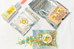 Glitter in a pouch, Jello and baking soda, glue and slime activator all in their containers. These go to our Bunny Snack Slime Kit
