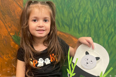 Child holding a bobbly head panda bear craft from the Wiggle Worms kit-China. Join the fun as we travel the world! 