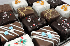 Image of a box of our Winter Combo including our winter flavors, the Peppermint Brownie Bite and the Gingerbread Blondie Bite.