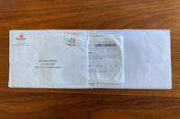 DVD emerging from envelope.