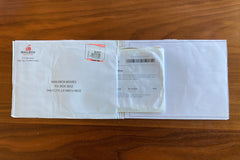 DVD emerging from envelope.