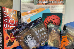 Dungeon Crate™ subscription box featuring exclusive member card, flame miniatures, and a treasure token for roleplaying games