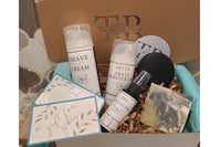 The subscription box includes an all-natural men's shave set, soap, and shampoo bar.  Lightly scented, or unscented options.